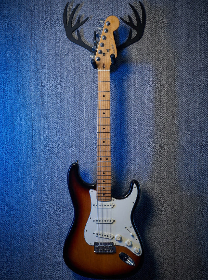 Cross Guitar Hanger on the wall